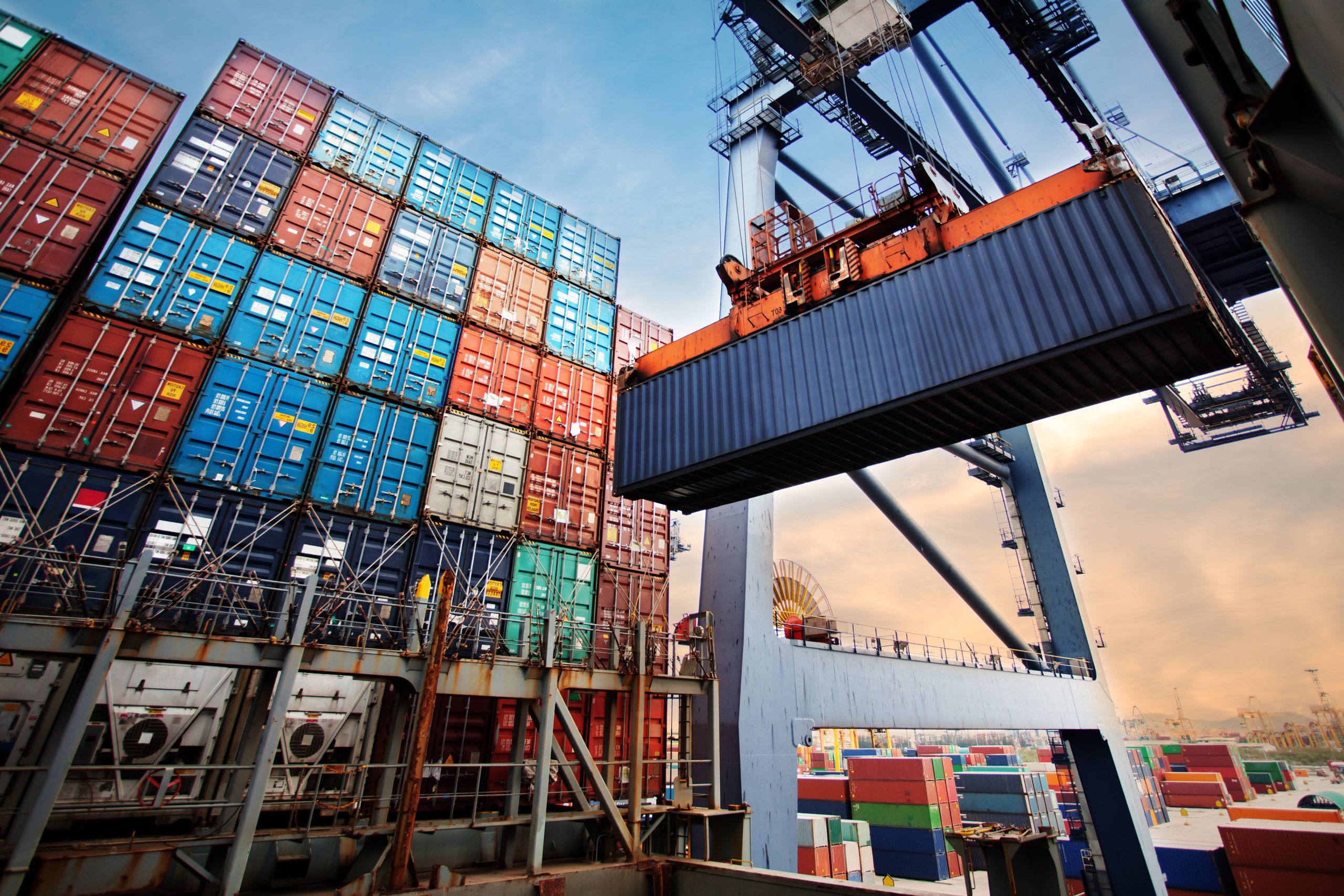 Container loading in a Cargo freight ship with industrial crane.